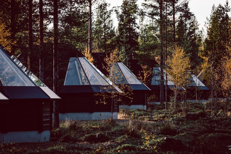 Aurora Cabins with the Autumn foliage. Ruska vacation to Aurora Village Ivalo Lapland Finland.