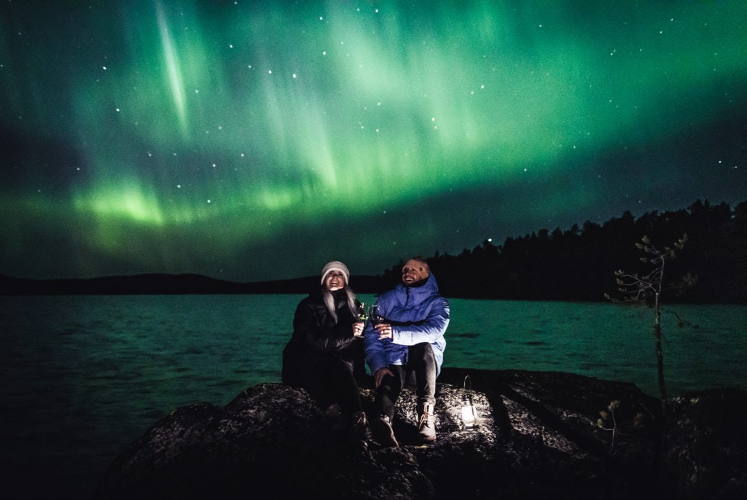 Our friends Mattia and Heini watching Aurora Borealis in Ivalo Lapland Finland.