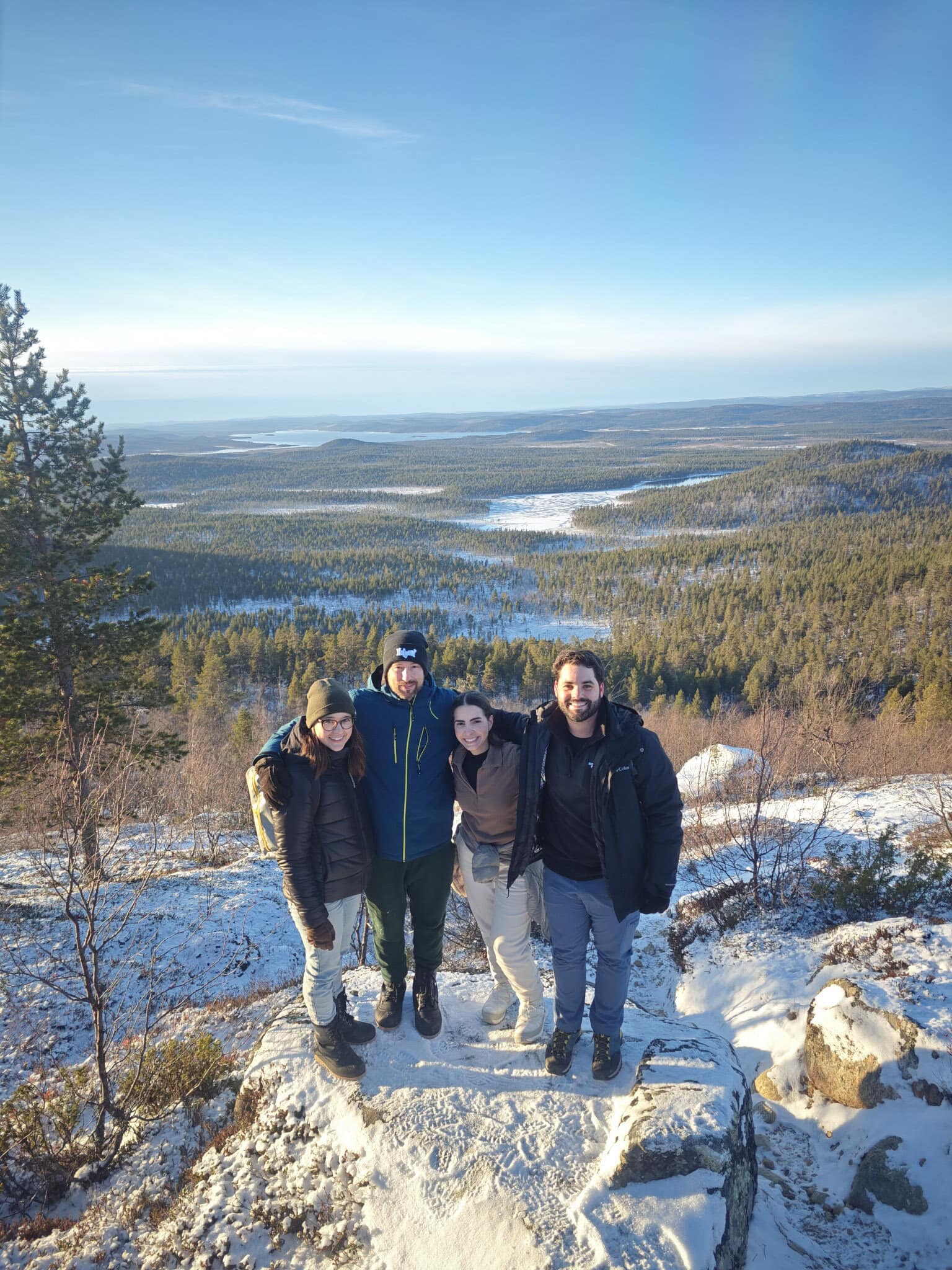 Guests on a hiking tour above a lightly snow-covered Lapland landscape on 1 November 2024
